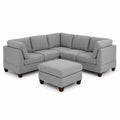 Divano angolare in tessuto grigio con pouf
